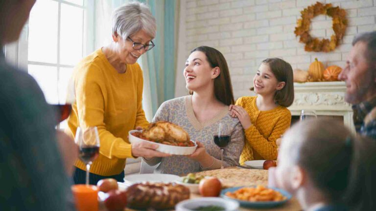 Family gathering at the holidays considering how they will be Paying for Nursing Home Costs